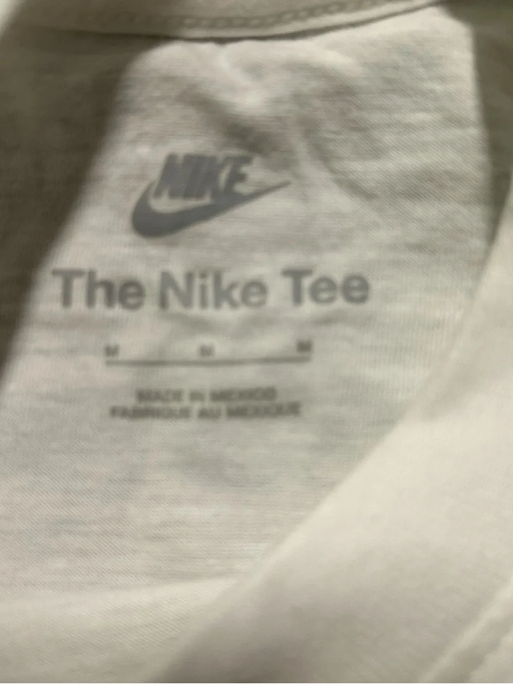 Nike White Tee with Brown Football and Blue Logo